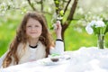 Little pretty girl in the green garden Royalty Free Stock Photo