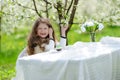 Little pretty girl in the green garden Royalty Free Stock Photo