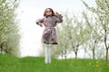 Little pretty girl jumping in the green garden Royalty Free Stock Photo