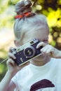 Little pretty girl with retro camera Royalty Free Stock Photo