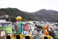 Little prince figure and fox statue at viewpoint with view landscape cityscape of Gamcheon Culture Hill Village or Santorini of