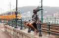 Little Princess landmark statue or Kiskiralylany sitting on the railings of the Danube promenade. Budapest, Hungary