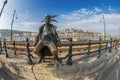 Little Princess statue sitting on the railings of the Danube promenade, Budapest, Hungary
