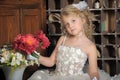 Little princess in white dress and red flowers Royalty Free Stock Photo