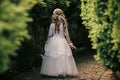 Little Princess. Young girl holding flowers