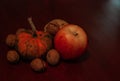 Little pumpkin,apple,pear and  nuts Royalty Free Stock Photo