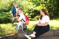 Little puppy jack russel terrier walking with owners. Kids and dog are best friends Royalty Free Stock Photo