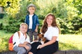 Little puppy jack russel terrier walking with owners. Kids and dog are best friends Royalty Free Stock Photo