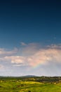 Little rainbow over hills of Val d'Orcia in Tuscany Royalty Free Stock Photo
