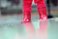 Little red boots in the rain Royalty Free Stock Photo