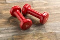 Little red dumbbells on the floor Royalty Free Stock Photo