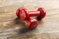 Little red dumbbells on the floor Royalty Free Stock Photo