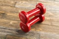 Little red dumbbells on the floor Royalty Free Stock Photo