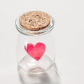 A little red felt heart in a small jar Royalty Free Stock Photo