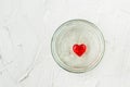 Little red heart in glass jar on white background Royalty Free Stock Photo