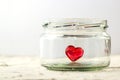 Little red heart in glass jar on white background Royalty Free Stock Photo
