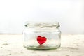 Little red heart in glass jar on white background Royalty Free Stock Photo