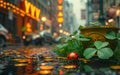 Little red ladybug is sitting on clover leaf in the middle of puddle in the city. Royalty Free Stock Photo