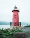 The Little Red Lighthouse on a foggy evening, along the Hudson River in Washington Heights, Manhattan, New York City Royalty Free Stock Photo