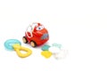 little red plastic car toy for newborn babies isolated, toys for children, kids development, playing Royalty Free Stock Photo