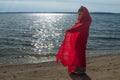 Little Red Riding Hood Girl on the Beach with Cape Royalty Free Stock Photo