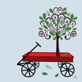 Little red wagon with tree Royalty Free Stock Photo