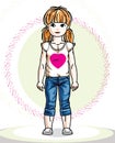 Little redhead girl toddler standing in fashionable casual clothes.
