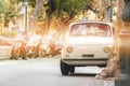 Little retro car on the street old vintage, beautiful summer day in Italy, travel tour Royalty Free Stock Photo