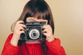 Little retro photographer with an old camera Royalty Free Stock Photo