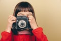 Little retro photographer with an old camera Royalty Free Stock Photo