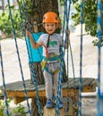 A little rock climber tie a knot on a rope. A person is preparing for the ascent. The child learns to tie a knot. Checking the ins Royalty Free Stock Photo