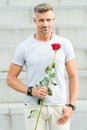 Little romance can enhance your love life. Handsome guy with rose flower romantic date. Valentines day and anniversary