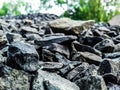 Little black stone and green background Royalty Free Stock Photo