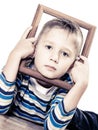 Little sad boy child framing his face Royalty Free Stock Photo