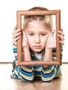 Little sad boy child framing his face Royalty Free Stock Photo