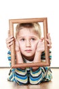 Little sad boy child framing his face Royalty Free Stock Photo