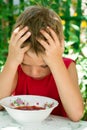 The little sad boy eats soup Royalty Free Stock Photo