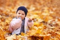 Little sad girl in the autumn park Royalty Free Stock Photo