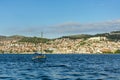 Little sailboat sailing the sea in front of the city of Sibenik . Royalty Free Stock Photo