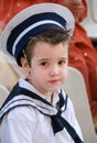 Little sailor. Boy with snot in his nose dressed in navy costume