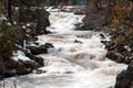 Little Salmon river in Idaho with white water and snow on the gr