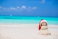 Little sandy snowman with red Santa Hat on white Royalty Free Stock Photo