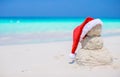 Little sandy snowman with red Santa Hat on white Royalty Free Stock Photo