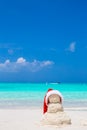 Little sandy snowman with red Santa Hat on white Royalty Free Stock Photo