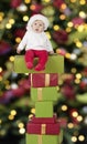 Little santa baby seated on presents Royalty Free Stock Photo