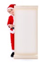 Little Santa Claus boy pointing at big wish list Royalty Free Stock Photo