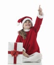 A little santa claus girl that indicates Royalty Free Stock Photo