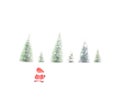 Little Santa Claus toy sitting in the snow in front of a row of pine trees Royalty Free Stock Photo