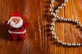 Little Santa Claus on a wooden background. New Year\'s decorations for the Christmas tree. Concept of winter holidays Royalty Free Stock Photo
