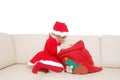 Little santa with red sack full of presents Royalty Free Stock Photo
